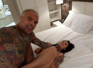 Tattooed couple engage in rough sex on top of their bed in self shot action on pornstar6.com