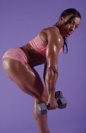 Black bodybuilder Karen Garrett displays her muscled physique on pornstar6.com