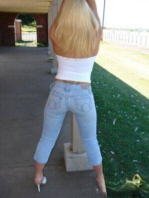 Blonde amateur Karen exposes her lace thong while outdoors in faded jeans on pornstar6.com