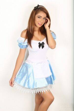 Naughty girl flashes no panty upskirt wearing Alice In Wonderland attire on pornstar6.com
