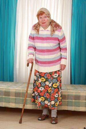 Fat old granny Alice with cane posing fully clothed in long skirt and socks on pornstar6.com