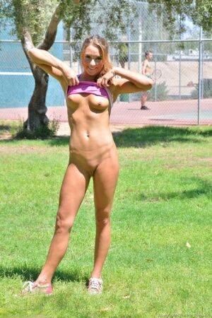 Fit blonde jogger in short shorts revealing wide open twat in public park on pornstar6.com