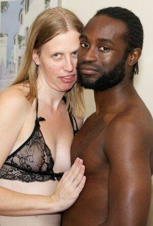 White amateur deepthroats her black lover's cock in lingerie ensemble on pornstar6.com