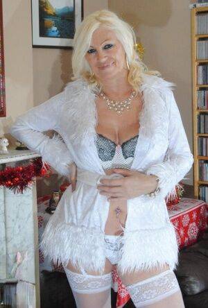 Older amateur Platinum Blonde shows her floppy tits in white panties & hosiery on pornstar6.com