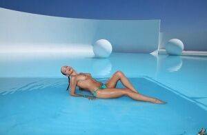 Lovely girl in glasses and bikini Celeste Star enjoys swimming in pool on pornstar6.com