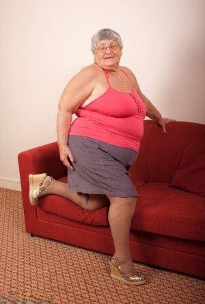 Obese nan Grandma Libby gets totally naked on a red chesterfield on pornstar6.com
