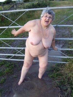 Fat nan Grandma Libby steps into a puddle before covering herself in mud on pornstar6.com