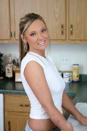 Horny girlfriend wets her white shirt in the kitchen showing her perky tits on pornstar6.com