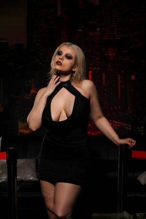 Nadia White looking hot in her black dress on pornstar6.com