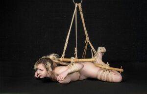 Naked white girl Kama Medea is suspended by ropes while anally hooked on pornstar6.com