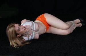 White girl with perky tits is blindfolded after being hogtied in shorts on pornstar6.com