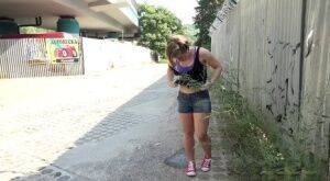 White girl pulls down her panties before squatting for a piss on country road on pornstar6.com