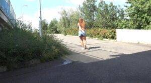 White girl Lucka pulls down jeans shorts for a pee on the side of a road on pornstar6.com