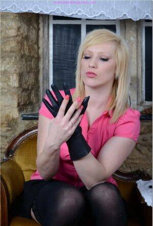 Natural blonde Axajay slides panties aside after donning leather gloves on pornstar6.com
