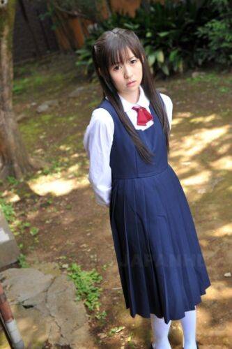 Charming Japanese babe posing in her cute school outfit in the garden - Japan on pornstar6.com