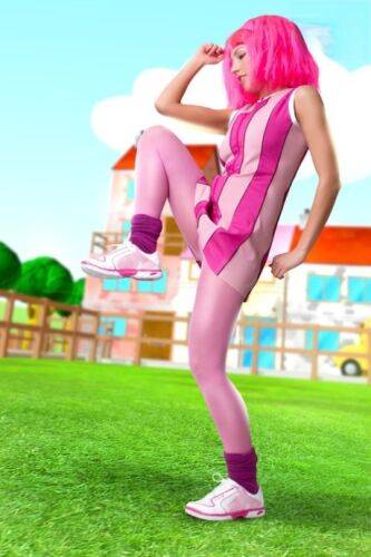 Adorable girl with pink hair Lazy Town exposes her nice body on a lawn on pornstar6.com