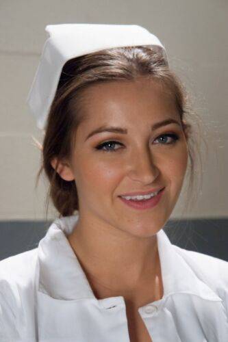 Gorgeous nurse with a nice butt Dani Daniels strips and poses in high heels on pornstar6.com