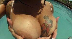 Hot Latina chick Cristine Castellari pools her big boobs out in swimming pool on pornstar6.com