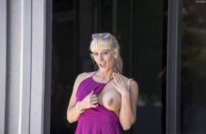Naughty blonde flashes no panty upskirts and her big tits out in public on pornstar6.com