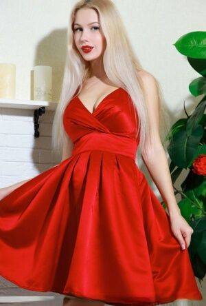 Nice blonde teen Genevieve Gandi removes red dress to display her trimmed muff on pornstar6.com