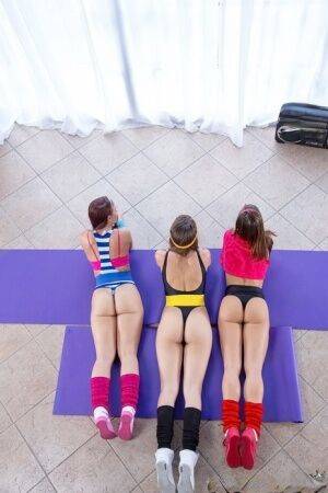 Three dykes in legs warmers and tights eat ass and pussy after a yoga session on pornstar6.com