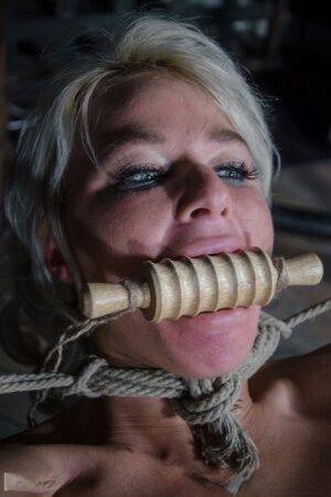 Platinum blonde London River is gagged and tied up in a dungeon on pornstar6.com