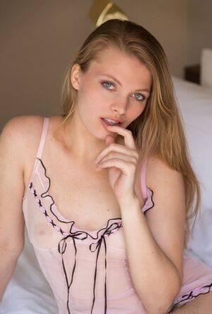 Nice teen Sophie Sparks sheds sheer lingerie to model naked on her bed on pornstar6.com