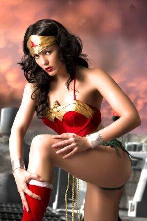 Beautiful brunette peels off her Wonder Woman outfit in a tempting manner on pornstar6.com