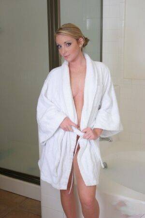 Blonde teen Abbie slips off a bathrobe for her first nudes in a bathtub on pornstar6.com