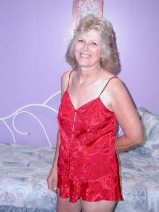 Classy granny in sexy red lingerie spreads hairy pussy on cam on pornstar6.com