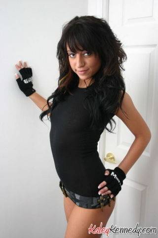 Kaley shows off her bullet belt on pornstar6.com