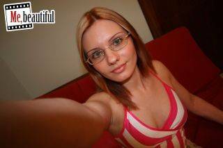 Hottie in glasses takes nasty photos of her bubbies and spread twat on pornstar6.com