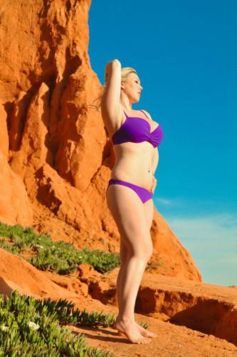 Erotic Lilac Bikini Is Falling Down To The Feet Of Busty Lyla Ashby Posing Outdoor on pornstar6.com