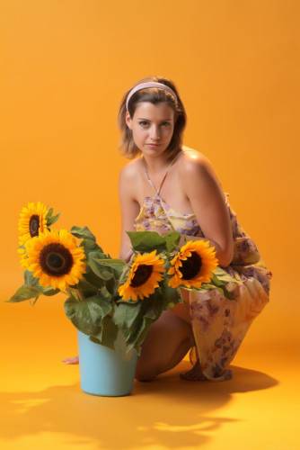 Wonderful Blonde Babe Vienna Is Getting Nude And Hotly Posing With Beautiful Sunflowers And Showing Her Boobs on pornstar6.com