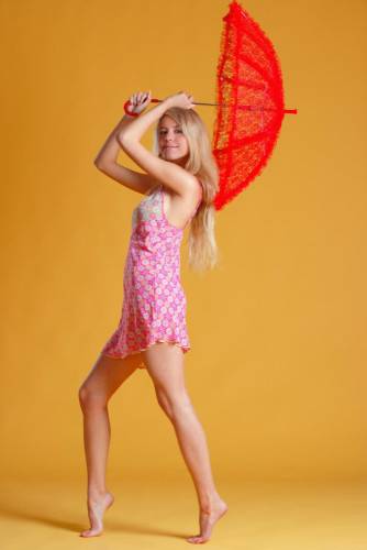 Leggy And Elegant Blonde Chick Barbara D Shows Off Her Fine Teen Bod With A Parasol on pornstar6.com