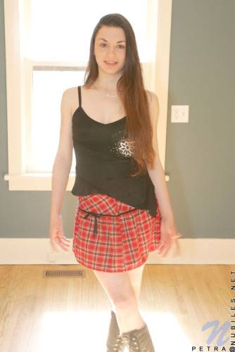 Shedding Her School Girl Uniform Petra Nubiles Exhibits Her Lean And Tight Body With Long Hair on pornstar6.com