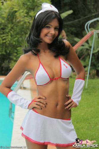 Swarthy Latina Karla Spice In White Uniform And Bikini Teasingly Poses By The Pool on pornstar6.com