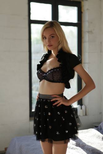Svelte blond teen Kira W in lingerie bares big boobs and butt on pornstar6.com