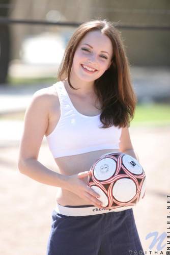 Smiling Sportive Girl Tabitha Nubiles In Snow White Top And Blue Shorts Poses With A Ball Outside on pornstar6.com