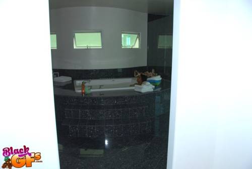 Curious black amateur Khloe Rain exposing her butt and spreading her legs in bath on pornstar6.com