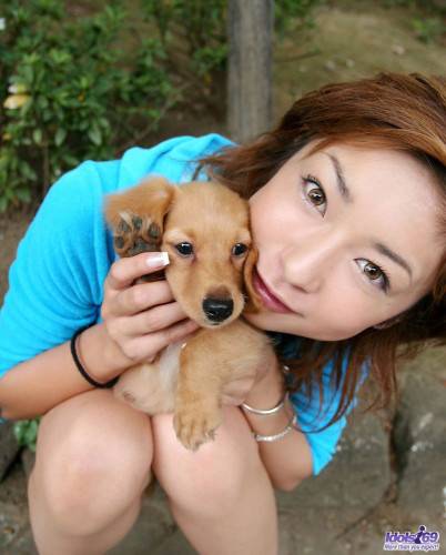 Posing With A Dog Is What One Of The Best Asian Babes Nao Idols Loves To Do. on pornstar6.com