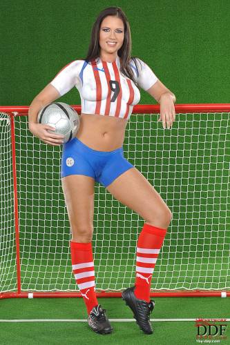 European Babe Veronica Da Souza In Painted Soccer Uniform Poses With A Ball on pornstar6.com
