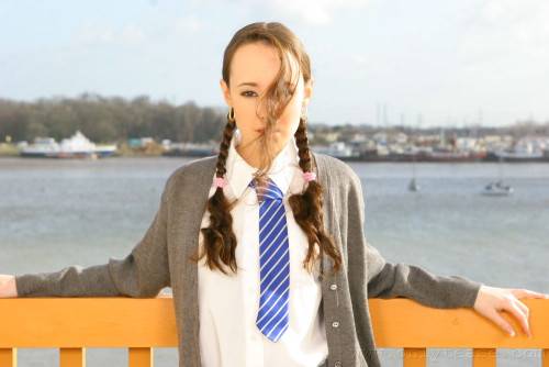 Flat Chested Schoolgirl Laura J In Pigtails Does Strip Tease On Balcony on pornstar6.com