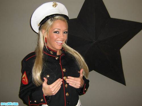 Smiling Tanned Blonde Foxy Jacky In Uniform Shows Her Smoothest Pussy And Round Tits on pornstar6.com
