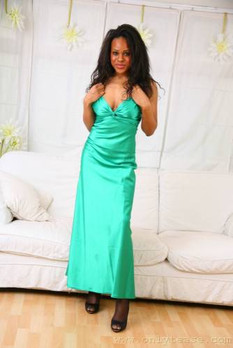 Frisky Black Honey Olivia B Does Some Posing In Long Green Evening Dress And Without It on pornstar6.com
