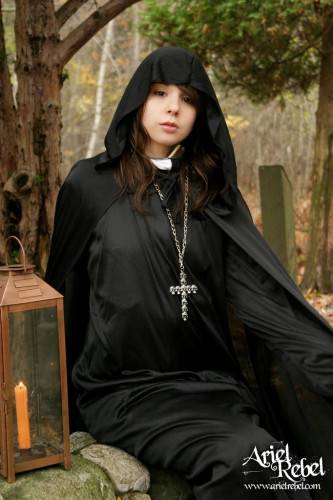 Naughty Teenage Nun Ariel Rebel Dressed In Black Flashes Her Bald Pussy Outdoors on pornstar6.com